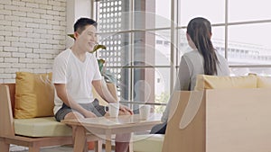 Family couple husband and wife laughing sitting in a cafe drinking coffee having talking