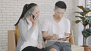 Family couple husband and wife working confirming booking having talking call phone