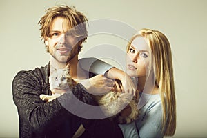 Family couple in love with cat, woman and happy man photo