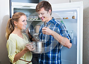 Family couple opened fridge and looking food photo