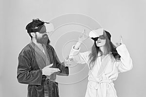 Family couple wear vr glasses. girl and man hipster relax in bathrobe. morning start with future technology. Another