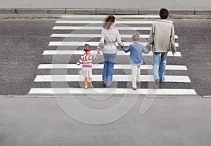 Family and crossing road, behind