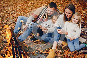 Family with cute kids in a autumn park