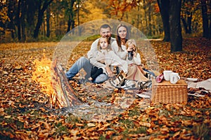 Family with cute kids in a autumn park