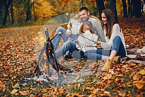 Family with cute kids in a autumn park