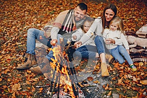 Family with cute kids in a autumn park