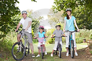 Family On Cycle Ride In Countryside