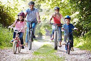 Family On Cycle Ride In Countryside