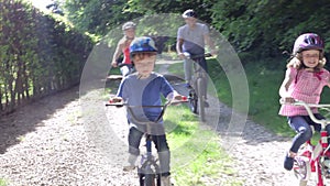 Family On Cycle Ride In Countryside