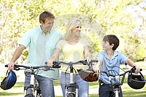 Family On Cycle Ride In Park