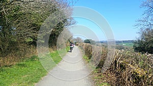 Family cycling along a dartmoor cycle path