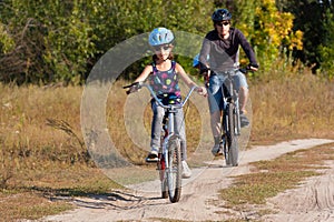 Family cycling outdoors