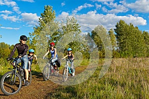 Family cycling outdoors