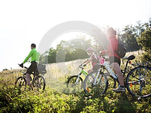 Family cycling outdoors