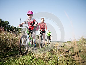 Family cycling outdoors