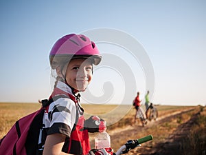 Family cycling outdoors