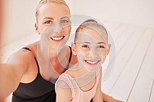 Family, dance and ballet with a mother and her young daughter taking a selfie in a dancing studio for the performing