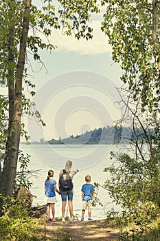 Family on a day hike together near a beautiful mountain lake