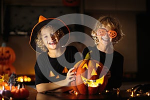 Family decorating home. Halloween arts and crafts photo