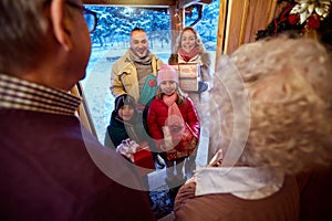 Family delivering presents at Christmas photo