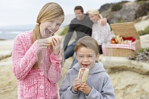 Family Dining Al Fresco At The Beach