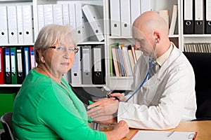 Family doctor examine a female senior