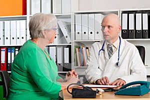 Family doctor examine a female senior