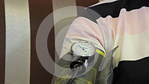 Family doctor measures patient`s blood pressure.