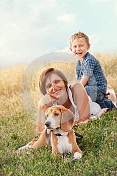 Family with dog have a calm leisure time outdoor