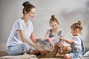 Family doing laundry at home