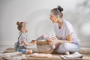 Family doing laundry at home