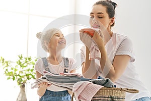 Family doing laundry at home