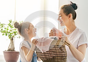 Family doing laundry at home