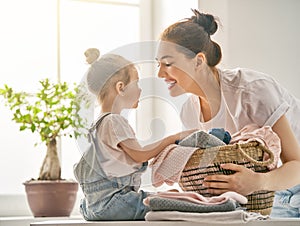 Family doing laundry at home