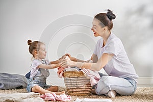 Family doing laundry at home