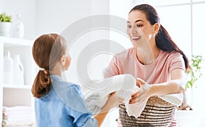 Family doing laundry at home