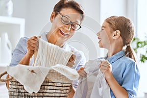 Family doing laundry at home