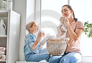 Family doing laundry at home