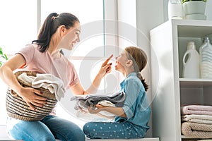 Family doing laundry at home