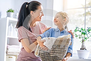 Family doing laundry at home