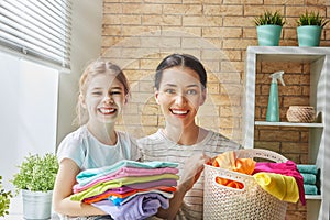 Family doing laundry at home