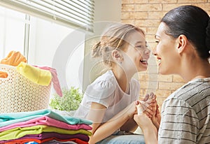 Family doing laundry at home