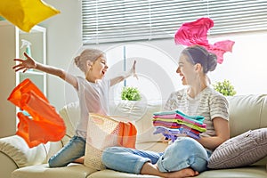 Family doing laundry at home