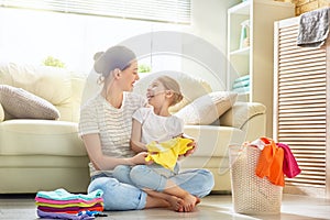 Family doing laundry at home