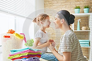 Family doing laundry at home