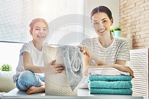 Family doing laundry at home