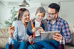 Family doing online shopping with tablet