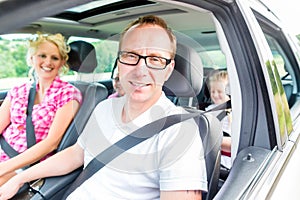 Family driving in car