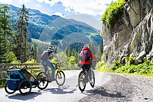 Family With E Bike MTB And Kid Trailer photo