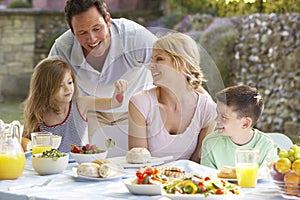 Family Eating An Al Fresco Meal